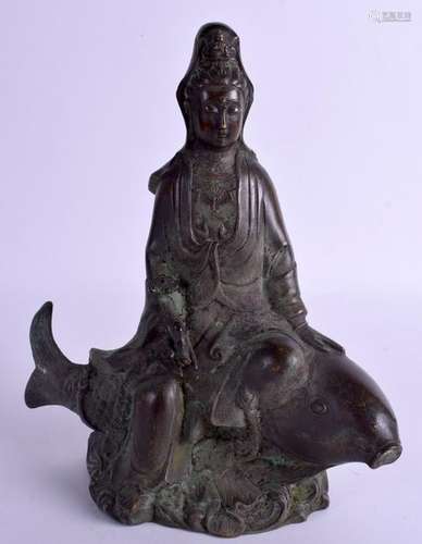 A CHINESE BRONZE FIGURE OF GUANYIN. 27 cm x 18 cm.