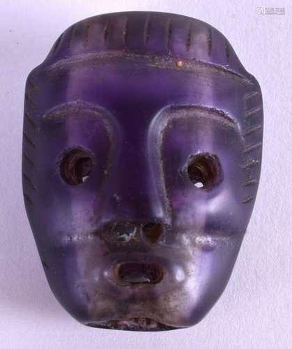 A VERY UNUSUAL CARVED PURPLE STONE MASK HEAD. 3.5 cm x