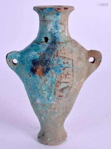 AN EGYPTIAN FAIENCE GLAZED FAIENCE VASE. 17.5 cm high.