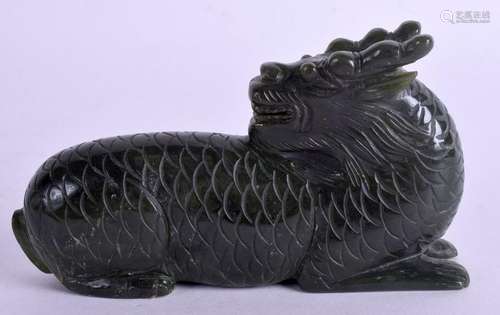 A CHINESE CARVED GREEN HARDSTONE BUDDHISTIC BEAST. 11