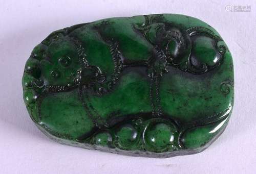 A MIDDLE EASTERN JADEITE PLAQUE. 3.5 cm x 5.5 cm.