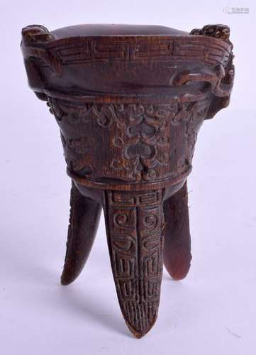 A CHINESE CARVED HORN LIBATION CUP. 11 cm x 8 cm.