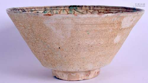 A MIDDLE EASTERN POTTERY BOWL. 24 cm wide.