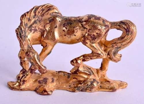 A CHINESE GILT BRONZE FIGURE OF A HORSE. 6 cm x 5 cm.