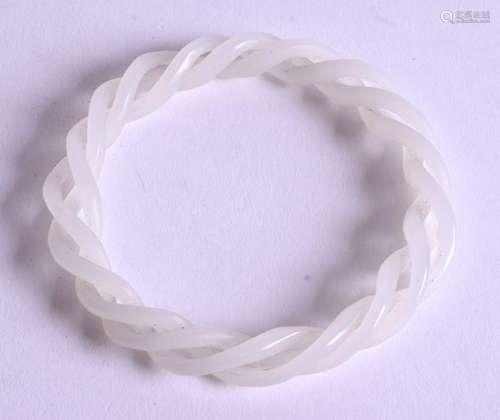 A CHINESE WHITE JADE TWIST BANGLE. 8.5 cm wide.