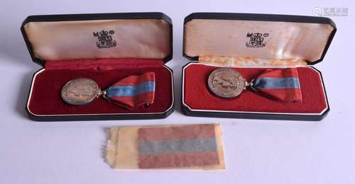 TWO BOXED SILVER MEDALS. (2)