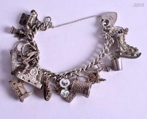 A SILVER CHARM BRACELET. 84 grams.