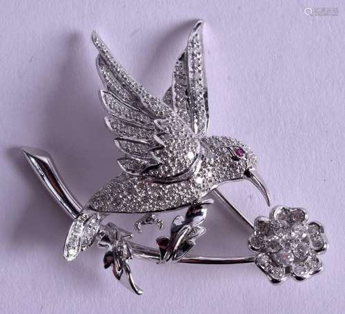 AN 18CT GOLD  AND DIAMOND BIRD BROOCH. 16.6 grams. 5 cm