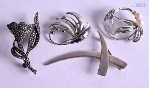 FOUR SILVER BROOCHES. (4)