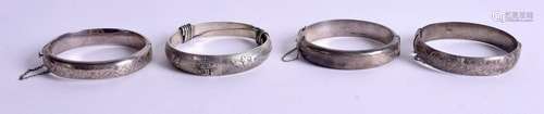 FOUR SILVER BANGLES. 102 grams. (4)