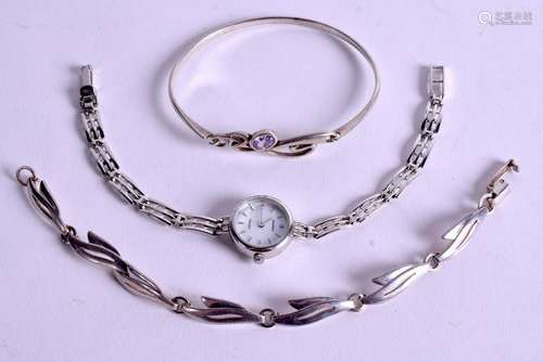 TWO SILVER BANGLES and a silver watch. (3)