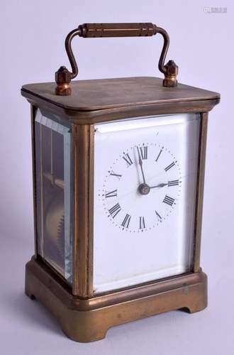 A BRASS CARRIAGE CLOCK. 13.25 cm high inc handle.