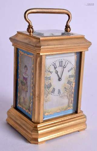 A MINIATURE PORCELAIN CARRIAGE CLOCK. 9 cm high inc