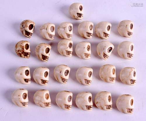 A COLLECTION OF ASIAN STONE SKULLS. (qty)