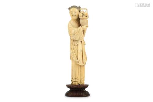 A CHINESE IVORY FIGURE OF MAGU.