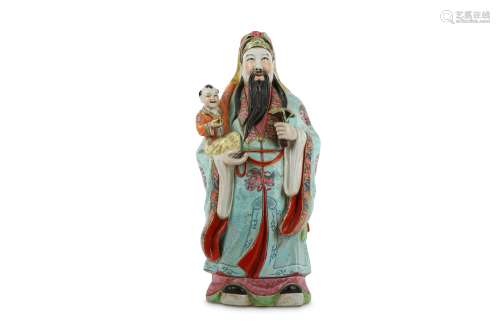 A CHINESE FAMILLE ROSE FIGURE OF AN IMMORTAL WITH A BOY.