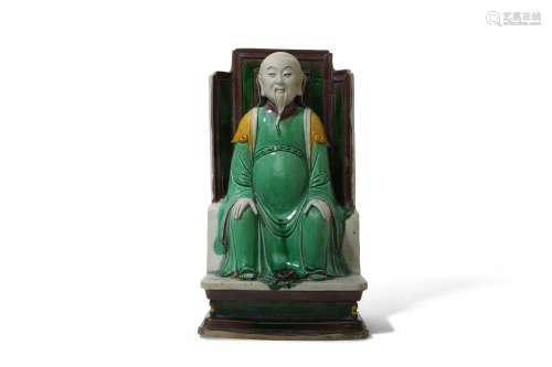 A CHINESE SANCAI-GLAZED BISCUIT FIGURE OF ZHENWU.