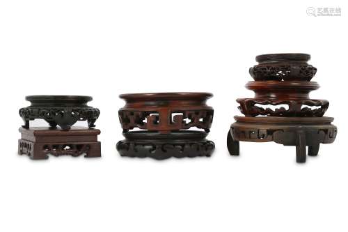 SEVEN CHINESE WOOD STANDS.