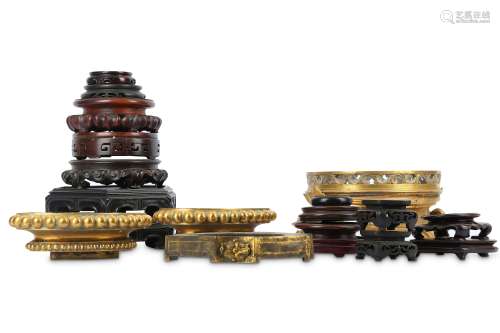 A COLLECTION OF CHINESE WOOD STANDS AND GILT BASES