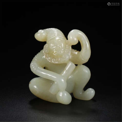 CHINESE CELADON JADE SEATED FIGURE