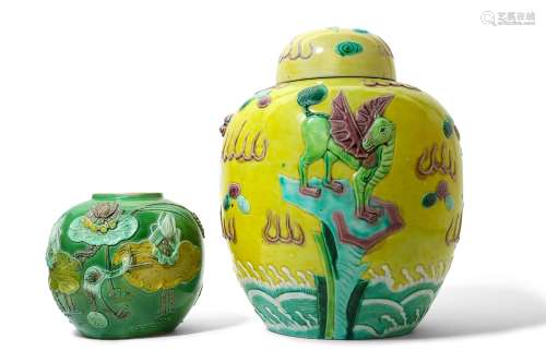 TWO CHINESE SANCAI-GLAZED BISCUIT JARS AND A COVER