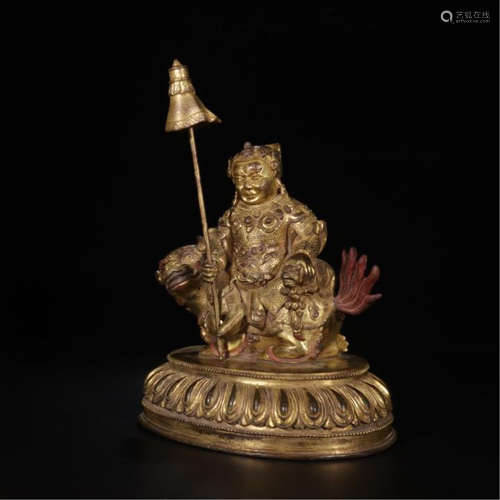 TIBETAN GILT BRONZE SEATED BUDDHIST GUARDIAN