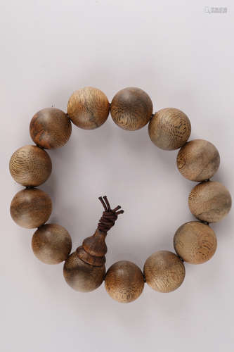 A Chinese Carved Agar-Wood Bracelet