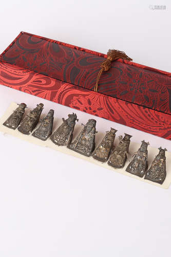 A Set of Eight Chinese Carved Silver Figures