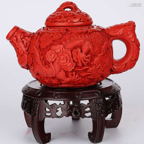 A Chinese Carved Tixi Lacquer Tea Pot with Stand