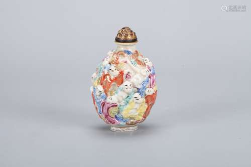 A Chinese Carved Famille-Rose Porcelain Snuff Bottle