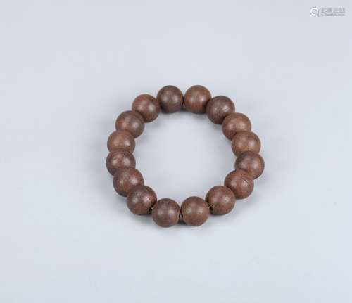 A Chinese Carved Agar-Wood Bracelet