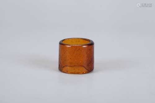 A Chinese Carved Brown Peking Glass Ring