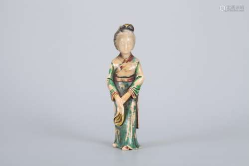 A Chinese Carved Painted Stone Figure