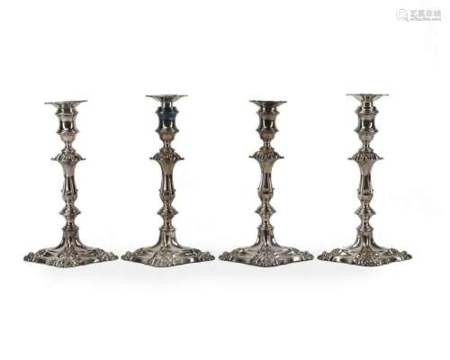 Four Continental silver plated candlesticks
