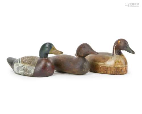 Three carved wood duck decoys