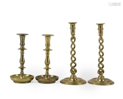 Two pairs of brass candlesticks