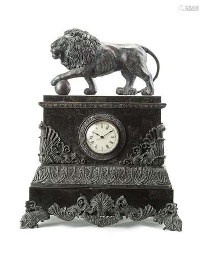 A patinated metal and marble mantel clock