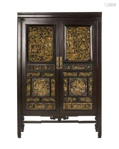 A Chinese carved wooden cabinet