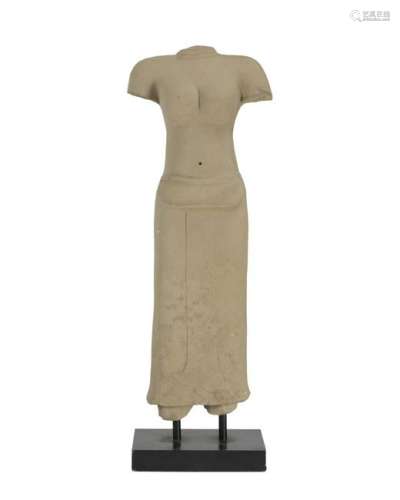 A Southeast Asian carved stone torso on stand