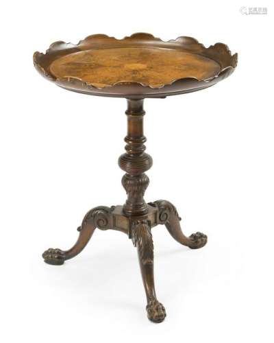A mahogany tilt-top table