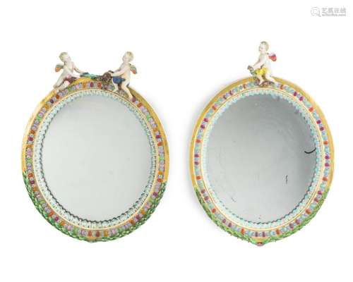 A pair of porcelain roundel mirrors