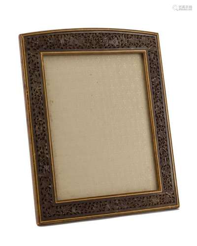 A carved soapstone and leather picture frame