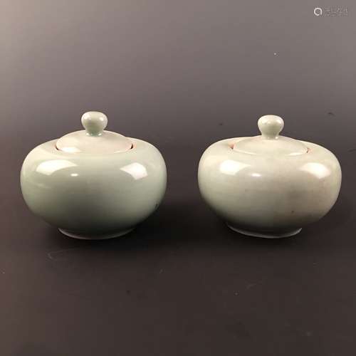 A Pair of Chinese Celdon Glazed Round Box and a Cover