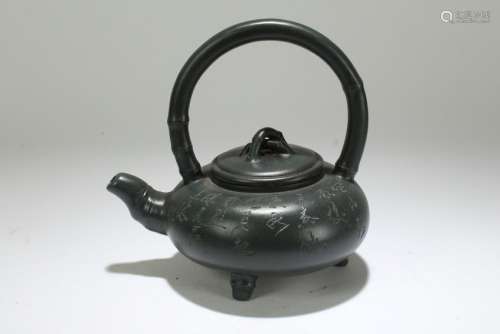 A Chinese Tri-podded Lidded Estate Tea Pot Display