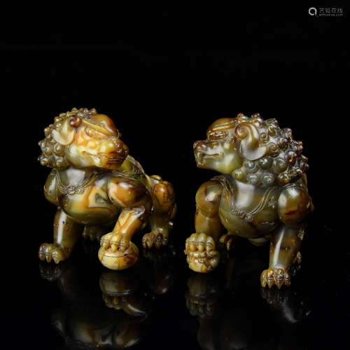 A Pair of Chinese Carved Agate Foo-Dogs