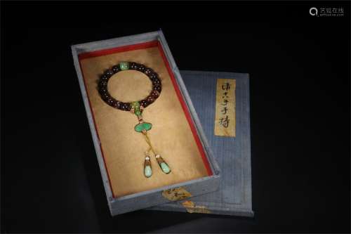 A Chinese Carved Tourmaline Prayers Beads