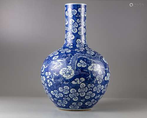 A Chinese blue and white 'dragon' bottle vase