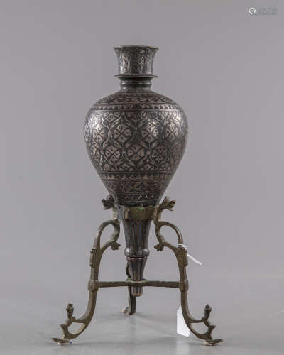 A Mughal silver inlaid bidri hookah base with a stand
