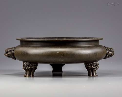 A Chinese bronze tripod censer