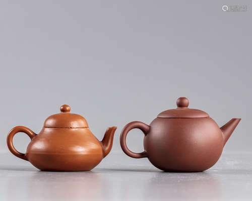 A pair of Chinese brown Yixing teapots